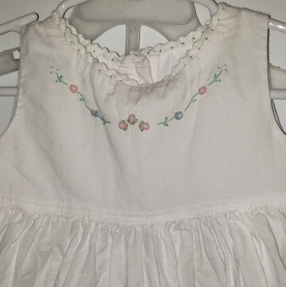 White dress with embroidered flowers